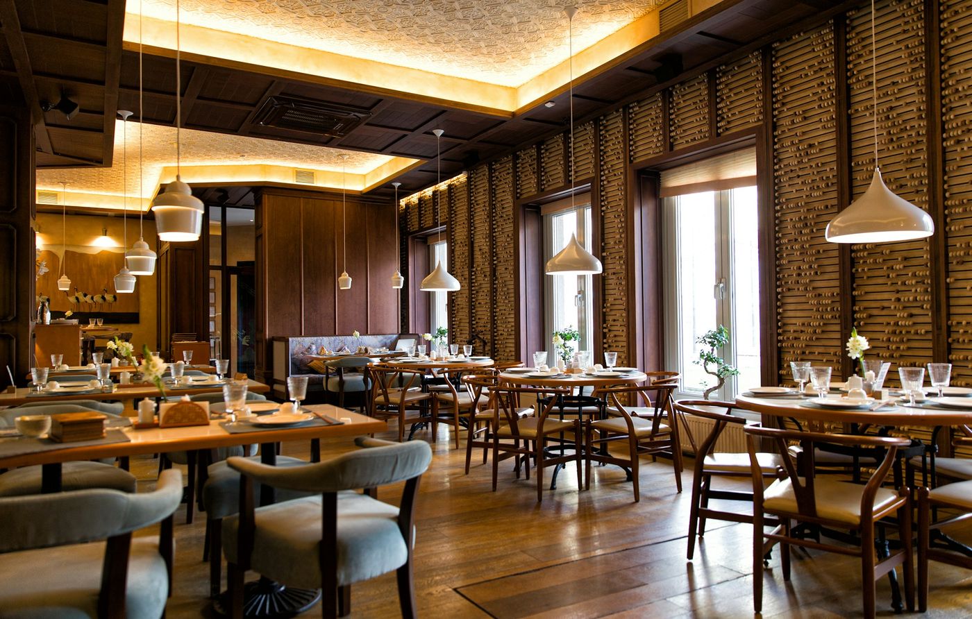 Dining room with pendant lamps and a window table